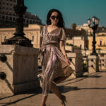 Metallic pleated dress with asymmetric hem